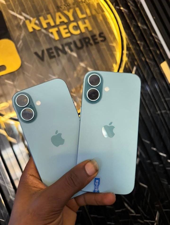 Dual flagship iPhones held before illuminated KhaylimTech gold sign